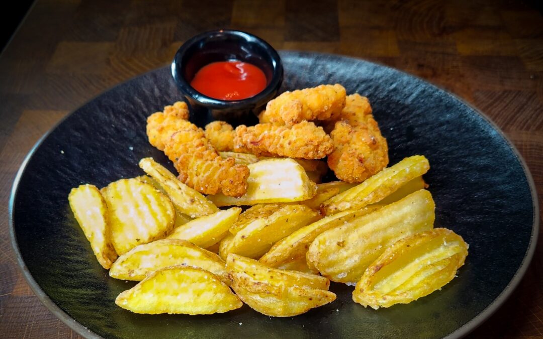 Deep fried chicken fillet and chips